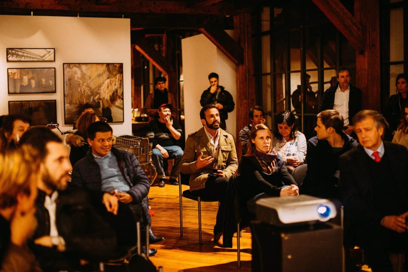 Group Of People Watching A Slide Presentation